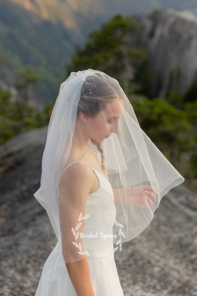 Bride wearing two tier fingertip veil with blusher and a line wedding dress for mountaintop wedding photography